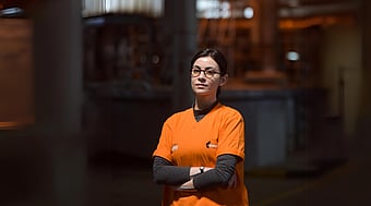 A picture of Melike Ede standing with her arms crossed.